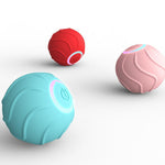 Three colorful balls (red, pink, and blue) on a white background
